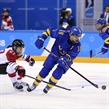 GANGNEUNG, SOUTH KOREA - FEBRUARY 10: Sweden's Anna Borgqvist #18 plays the puck while Japan's Shoko Ono #27 defends during preliminary round action at the PyeongChang 2018 Olympic Winter Games. (Photo by Andre Ringuette/HHOF-IIHF Images)

